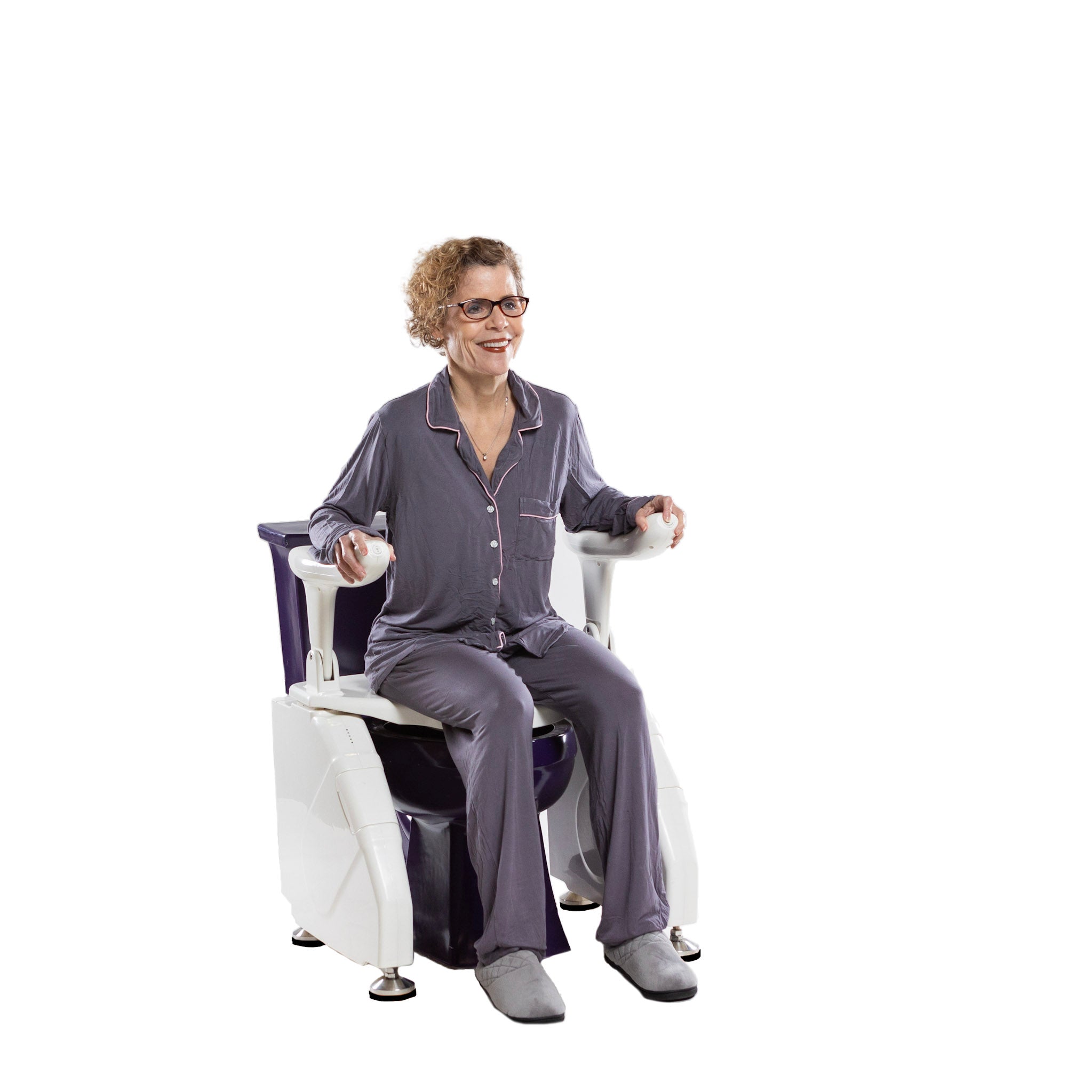Dignity Lifts Deluxe Toilet Lift DL2 - An older woman wearing glasses and a matching gray pajama set sits in a toilet with a toilet lift installed