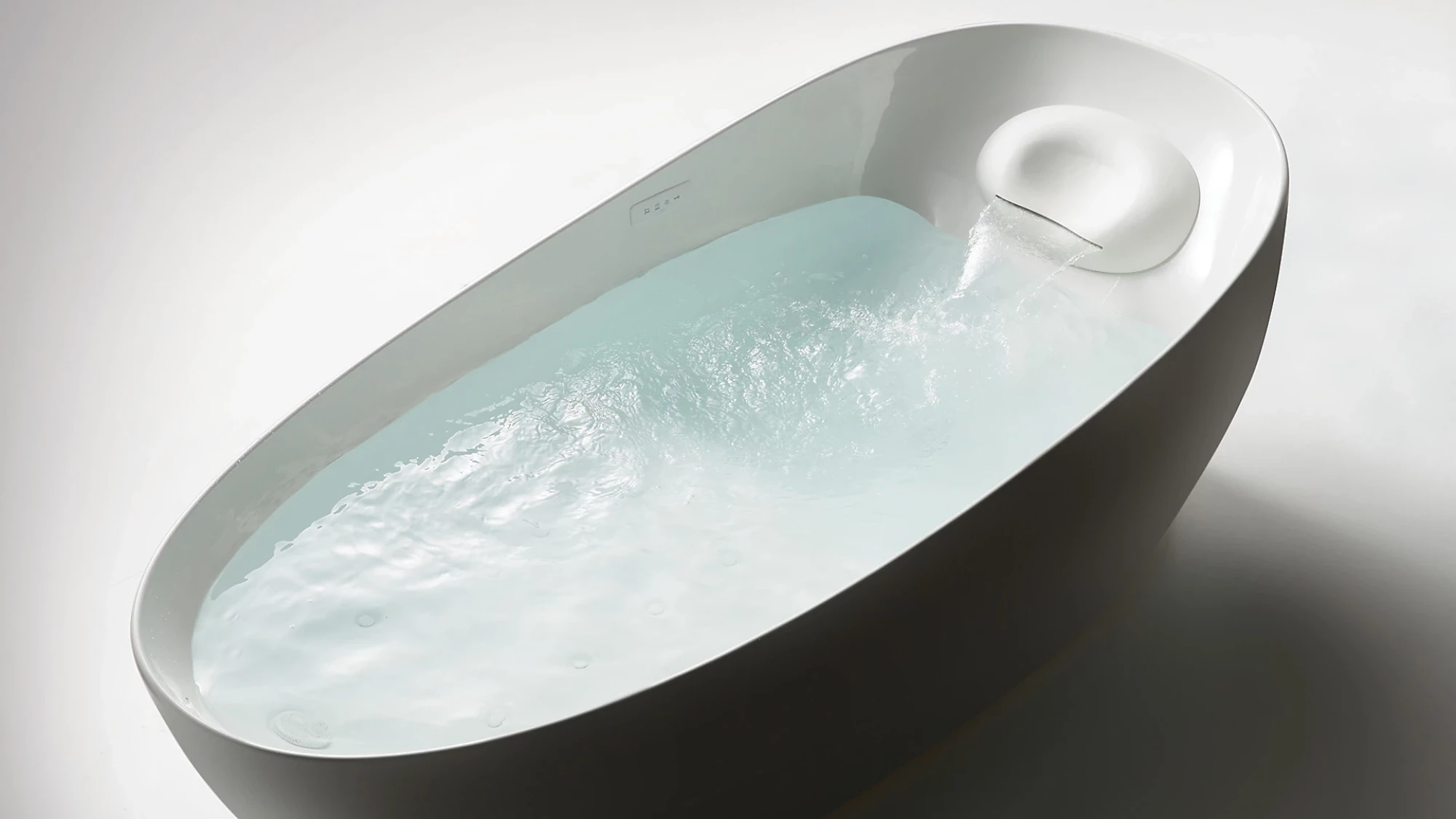 TOTO Flotation Tub With ZERO DIMENSION - Modern freestanding bathtub with water inside on a white background