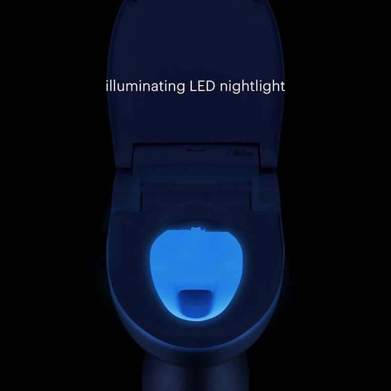 Brondell Swash DR802 Bidet Toilet Seat with illuminating LED nightlight feature in dark bathroom setting.