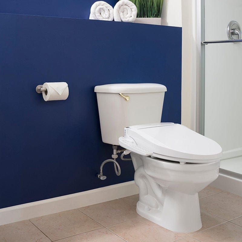 Brondell Swash EM417 bidet toilet seat installed in modern bathroom with blue accent wall and shower in background.