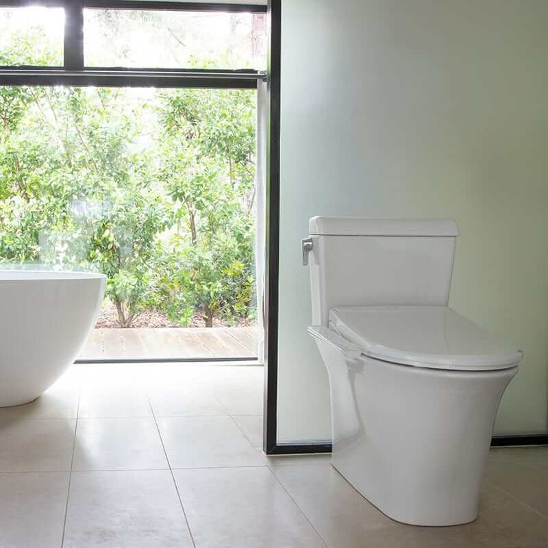 Brondell Swash Thinline Bidet Toilet Seat T22 in modern bathroom with heated seat and stainless steel nozzle features.