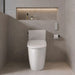 Duravit Sensowash Arcova Universal Bidet Seat - A modern white ceramic toilet with a closed lid, set in a minimalist bathroom with light gray stone tiles and a recessed shelf with warm lighting above it.