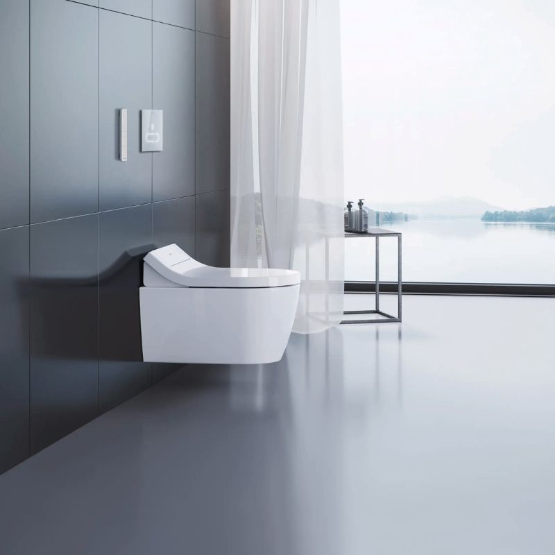 Duravit SensoWash Classic Starck Bidet Seat - Side view of wall hanging modern toilet on a modern bathroom overseeing a lake