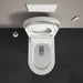 Duravit SensoWash Starck I Lite - A top-down view of a modern white wall-mounted toilet with the lid open, set against a dark charcoal tiled wall and a light gray ceiling with integrated fixtures.