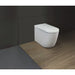 Duravit SensoWash Starck I Pro - A modern toilet with a white ceramic body and lid, shown installed against a dark gray tiled wall and wood-look floor.