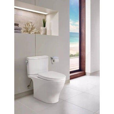 TOTO Nexus Two Piece Toilet - Modern white toilet in a bathroom with a scenic view outside