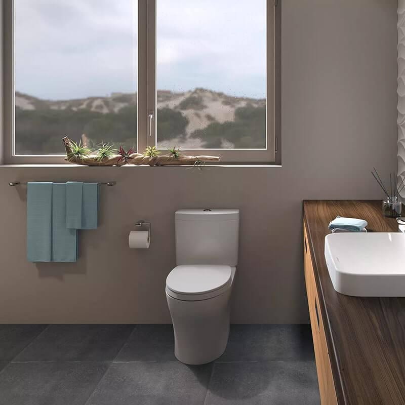 TOTO Aquia IV Two-Piece Toilet in modern bathroom, featuring universal height and Washlet compatibility.