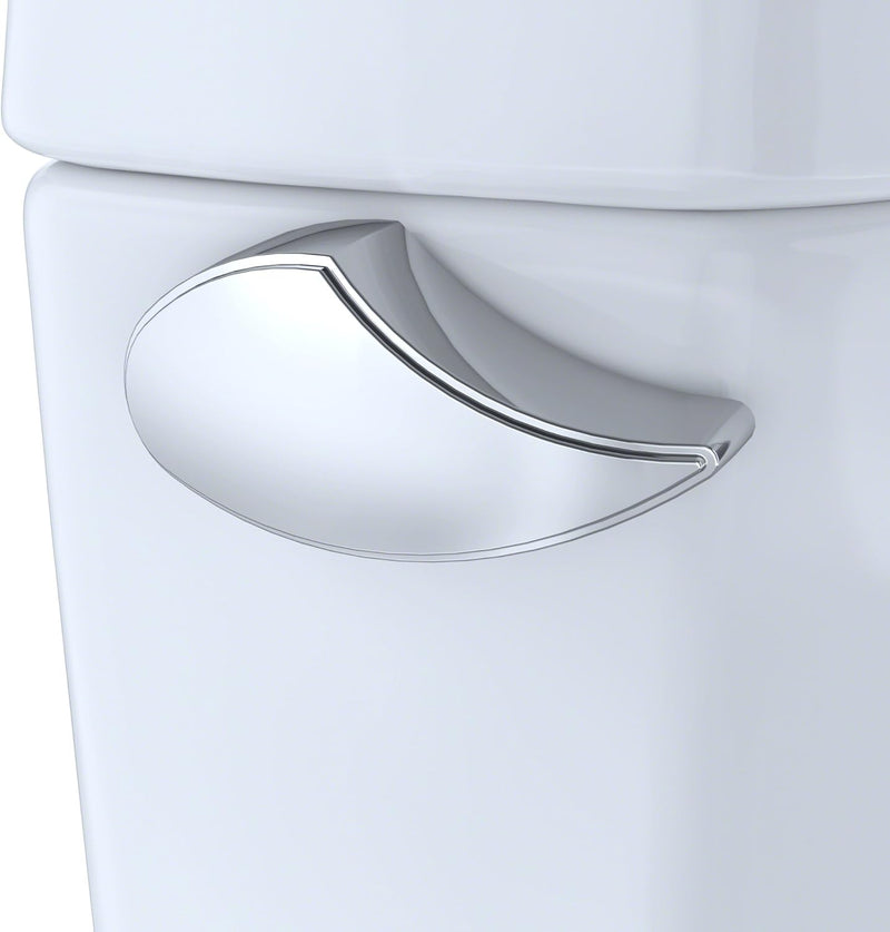 TOTO Drake Two Piece Toilet Elongated - Seat Included - Close-up of a white toilet with a silver handle on a white background