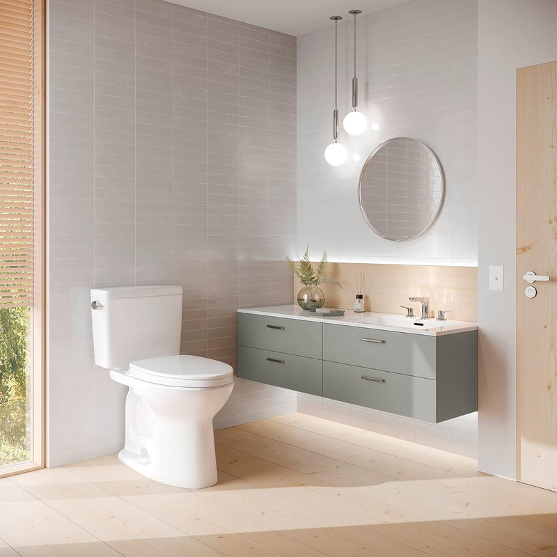 TOTO Drake Two Piece Toilet Elongated - Seat Included - Modern bathroom with a toilet, sink, and vanity unit.