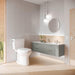 TOTO Drake Two Piece Toilet Elongated - Seat Included - Modern bathroom with a toilet, sink, and vanity unit.
