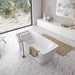 TOTO Flotation Freestanding Square Tub in a modern bathroom setting with large window and marble flooring.