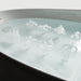 TOTO Flotation Tub showcasing Zero Dimension technology with bubbling water surface, featuring smooth white tub design.