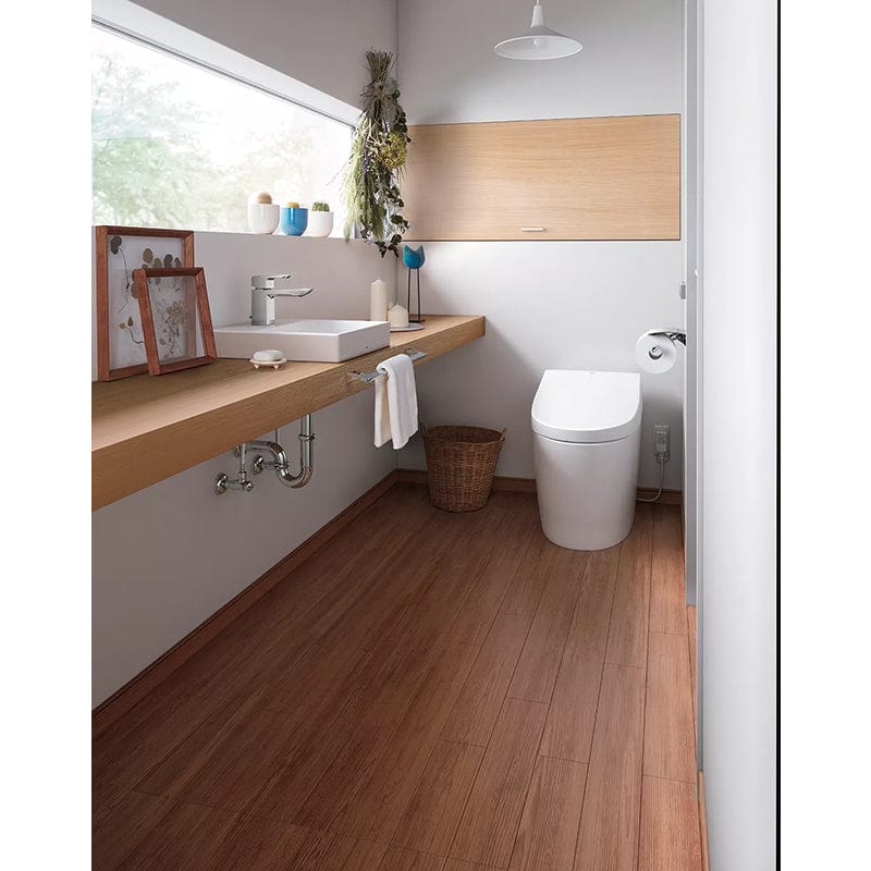 Modern bathroom featuring TOTO Neorest AH Dual Flush Integrated Bidet Toilet with wooden flooring and minimalist design.