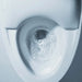 TOTO NEOREST NX2 Dual-Flush Toilet - Close-up of a toilet bowl with water swirling down the drain.