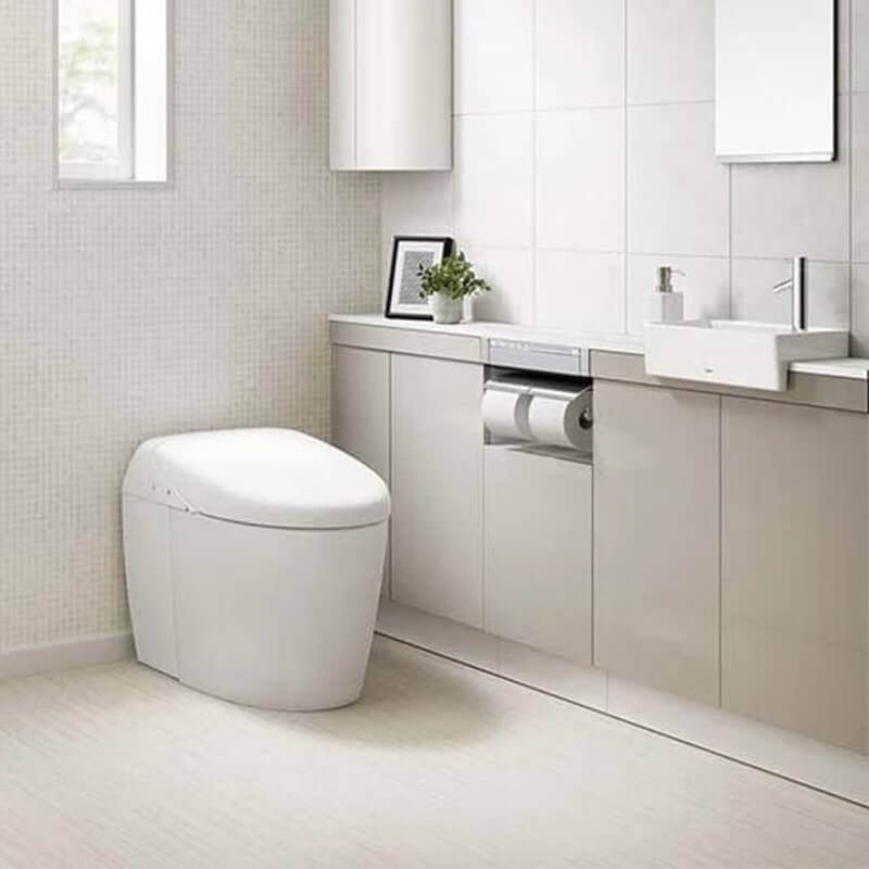 TOTO Neorest RH Dual Flush integrated bidet toilet in modern bathroom setting, highlighted for water efficiency and sleek design.