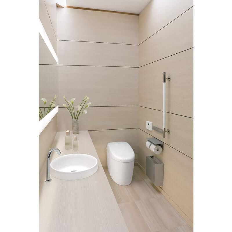 Modern bathroom featuring TOTO Neorest RH Dual Flush integrated bidet toilet with sleek design and wall-mounted accessories.