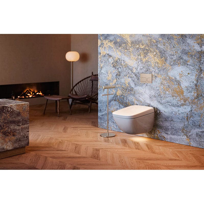 Modern bathroom with TOTO Neorest WX1 Wall Hung Bidet Toilet showcasing elegant design against marble wall and wooden flooring.