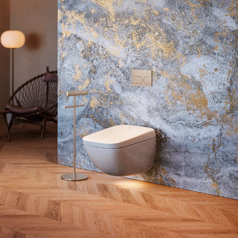 TOTO NEOREST® WX1 Wall-Hung Toilet - Modern wall-mounted toilet in a bathroom with marbleized wall and wooden floor.