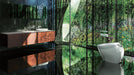 Modern bathroom with a large mirror reflecting a forest scene.