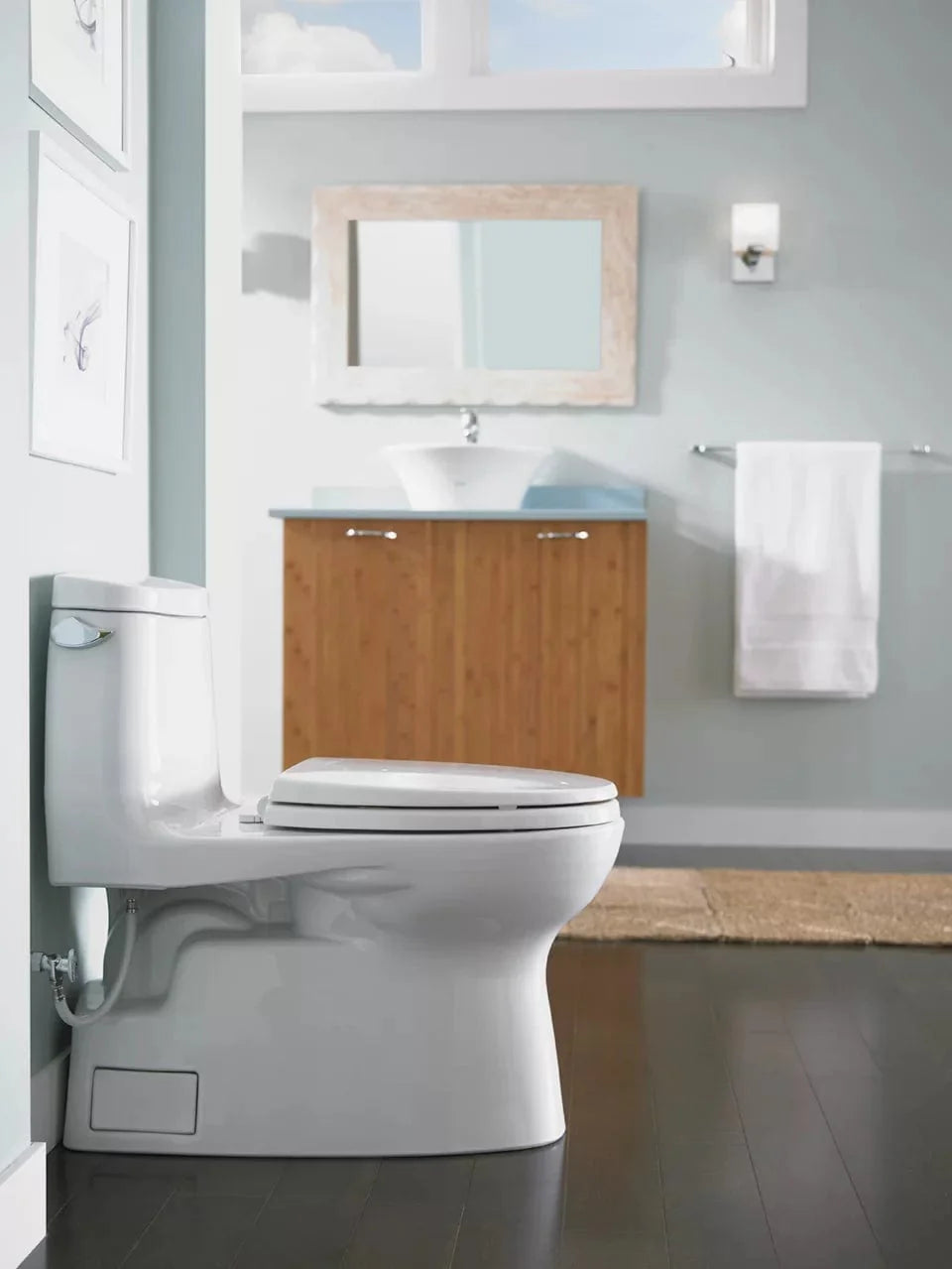 TOTO Carlyle II One-Piece Toilet in modern bathroom setting, featuring water-saving 1.28 GPF technology and sleek design.