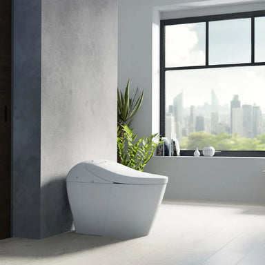 TOTO Washlet G5A Lite Integrated Smart Toilet - Modern white freestanding bathtub in a bathroom with a cityscape view